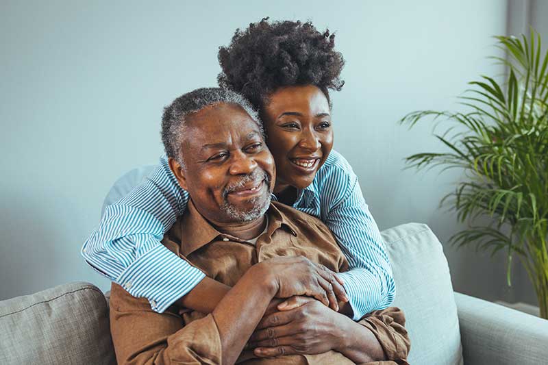 power of attorney lawyer massachusetts - Photo description: Adult daughter visits senior father in assisted living home.